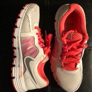 White and bright pink, dual fusion Nike’s